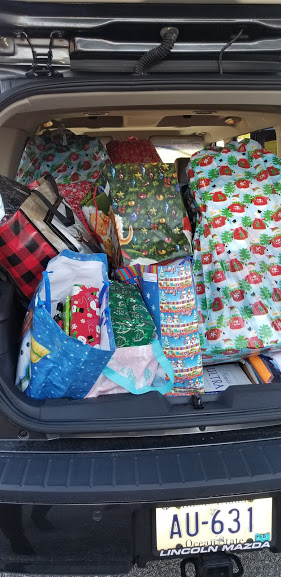 A car trunk full of Christmas presents