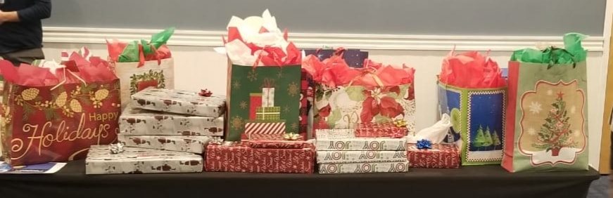Wrapped gifts and bags on a table