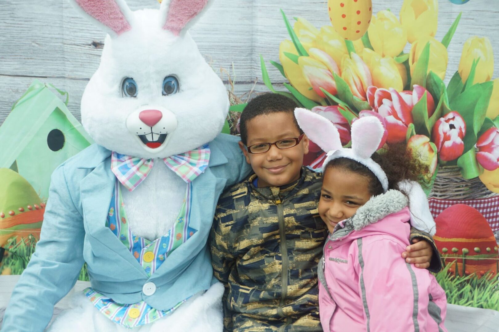 The bunny mascot and a boy and a girl with their arms around each other (2)