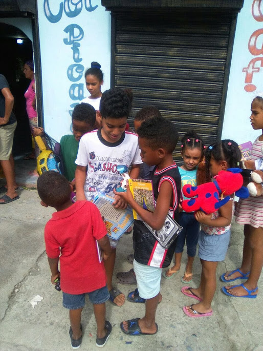 Children showing each other their toys outside the school