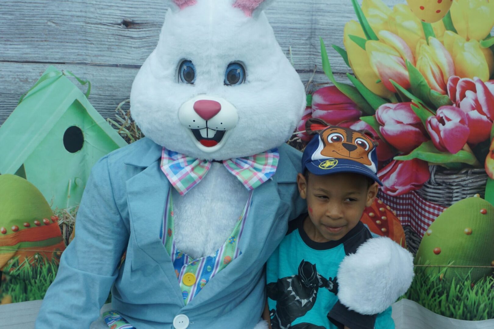 The bunny mascot and a boy wearing a blue cap