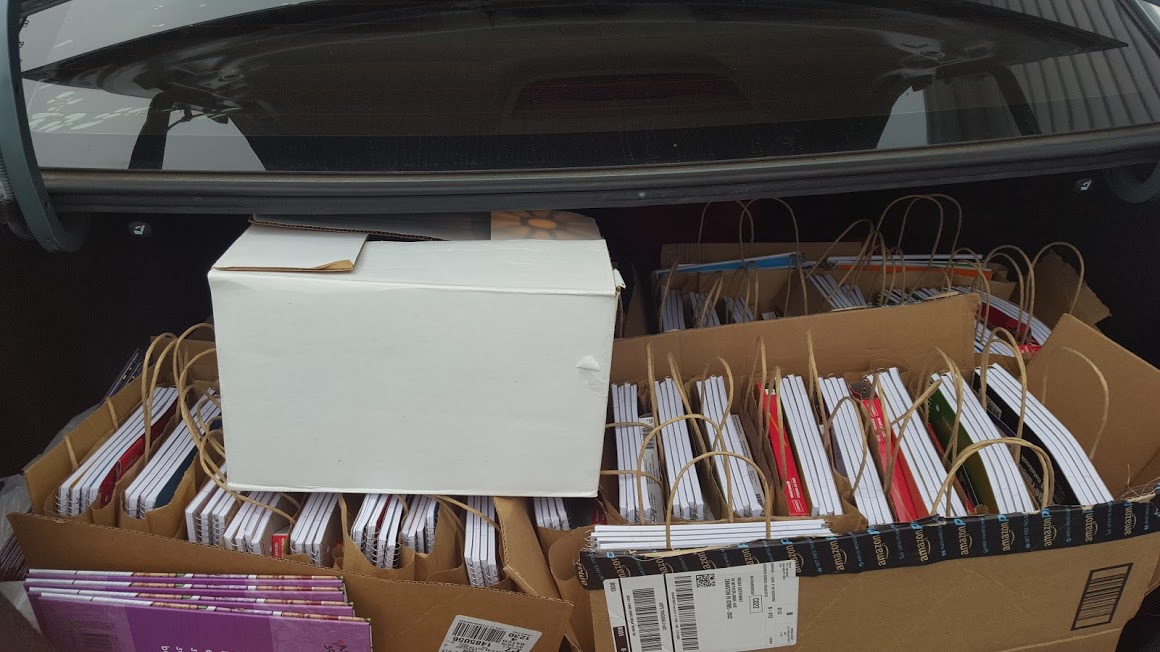 A car trunk with boxes full of books