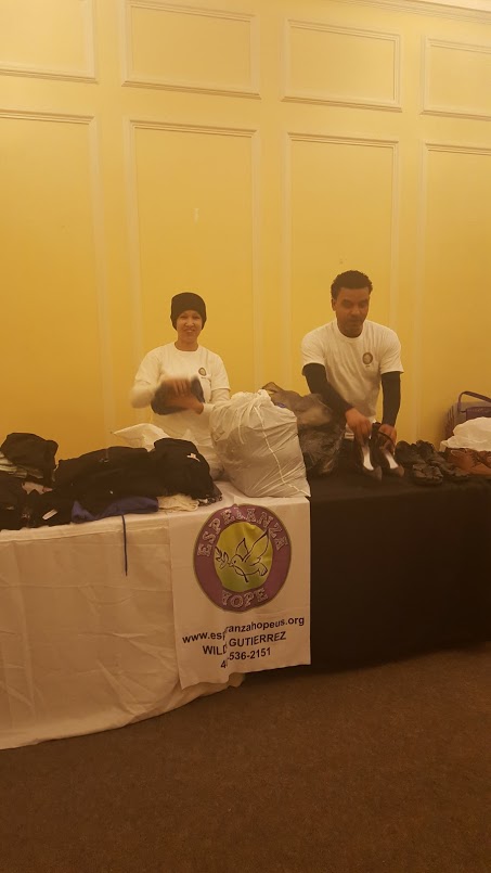 Our male and female staff placing the clothes and shoes on the table