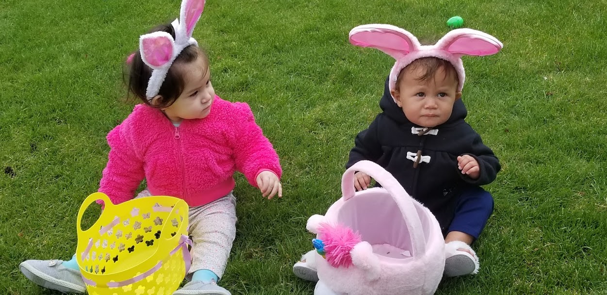 Two babies with bunny ears and cute baskets