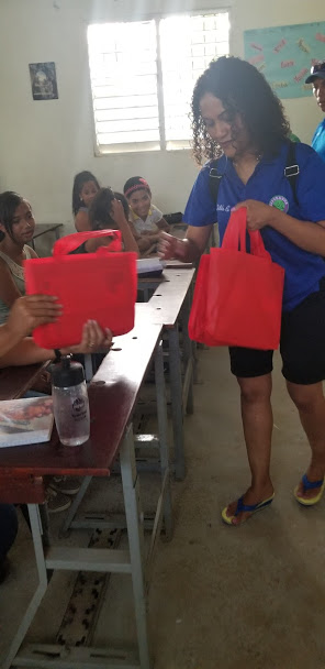 One of our members gives out red tote bags (2)