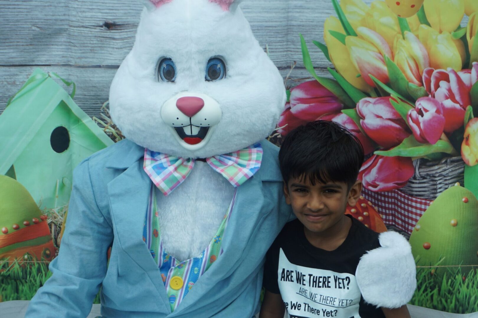 The bunny mascot and a boy in black shirt