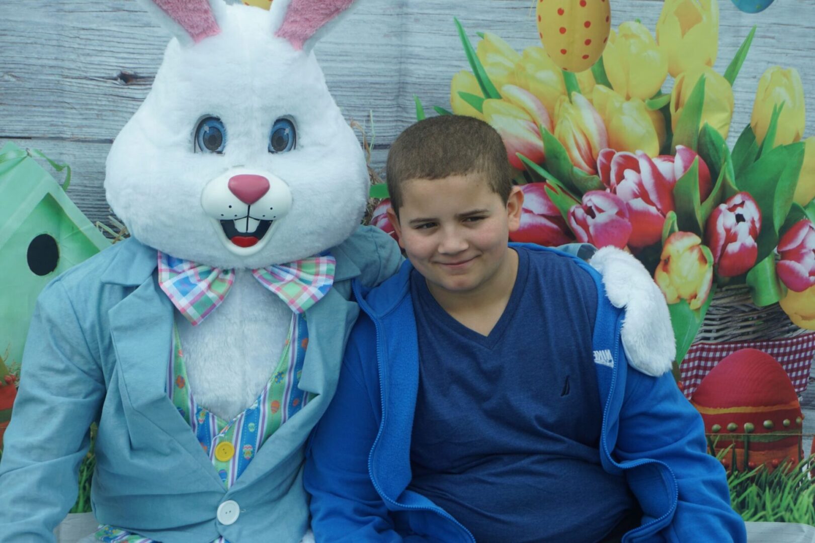 The bunny mascot and a boy in blue shirt and jacket
