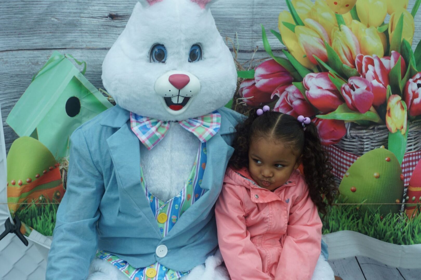 The bunny mascot and a girl in pig tails and pink coat