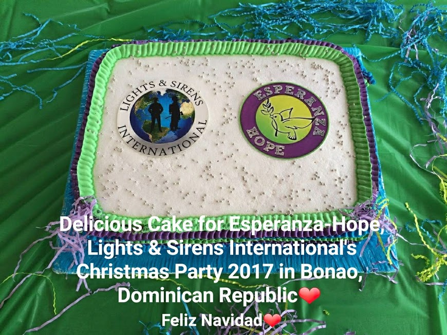 White cake with green and purple designs; Christmas Party 2017 in Bonao