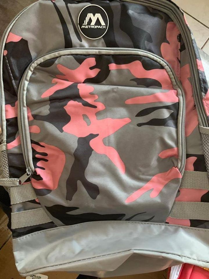 A gray and pink Metropack backpack