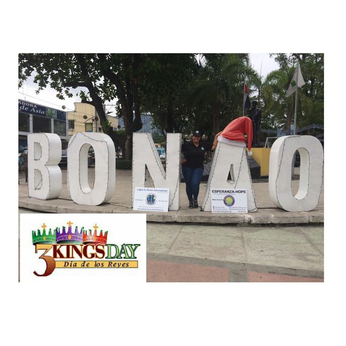 A female staff standing with the BONAO letters