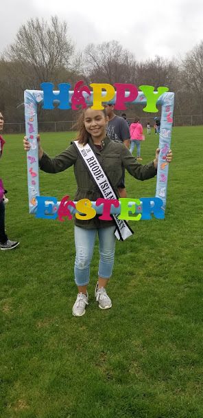 Ms. Rhode Island Galaxy holding the Happy Easter frame
