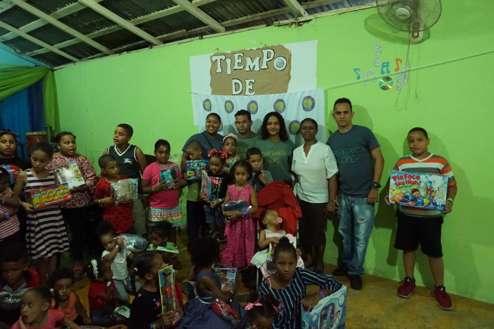 The staff and some of the adults from the Iglesia; the children beside them