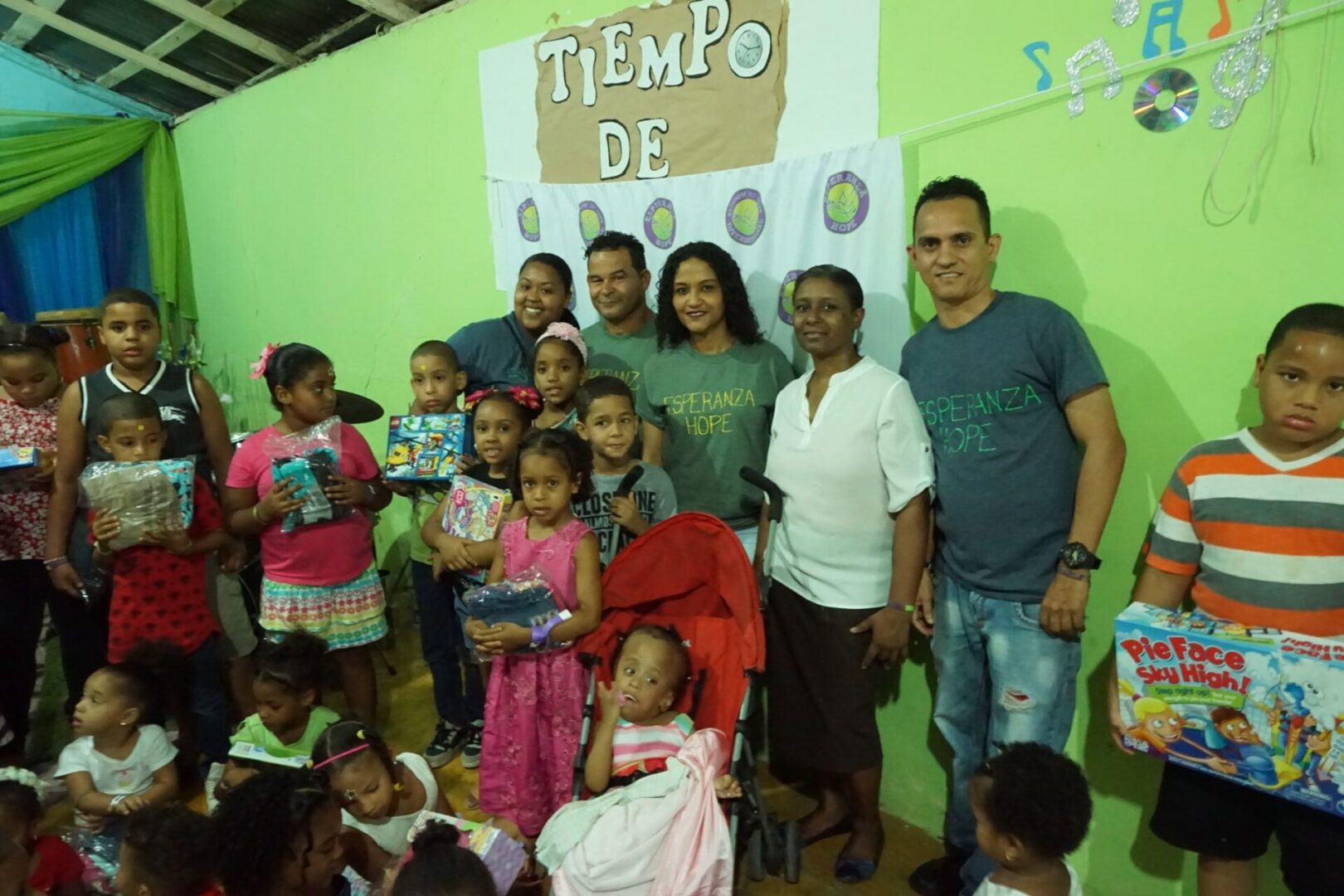 The staff and some of the adults from the Iglesia; the children around them