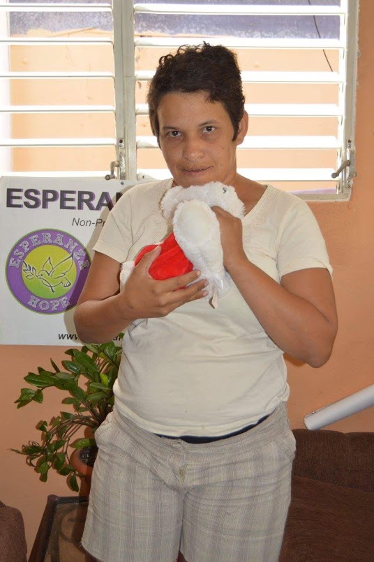 A woman holding a stuffed toy