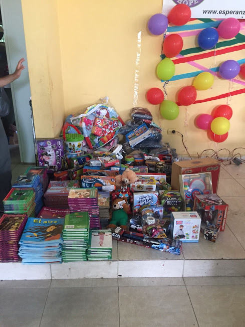 Clothes, books, and toys in one corner of the classroom
