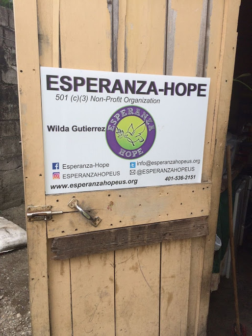 Esperanza-Hope placard placed on a wooden door