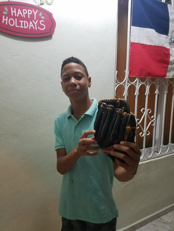 A boy holding a baseball glove
