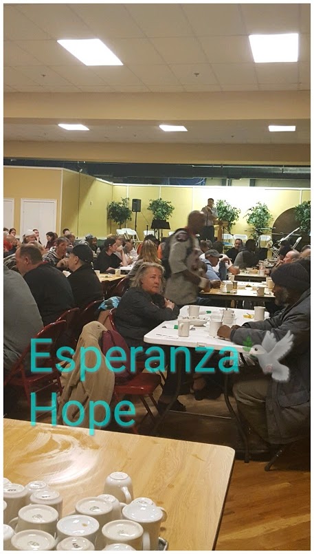 People eating. Text: Esperanza-Hope