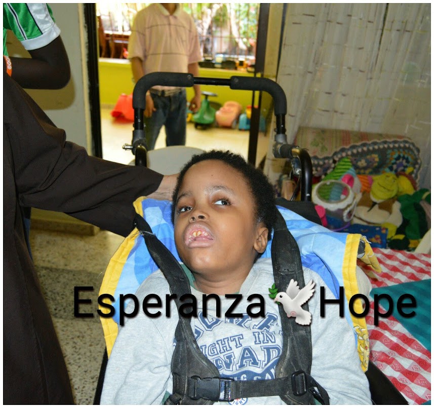 A boy in a wheelchair, text: Esperanza-Hope