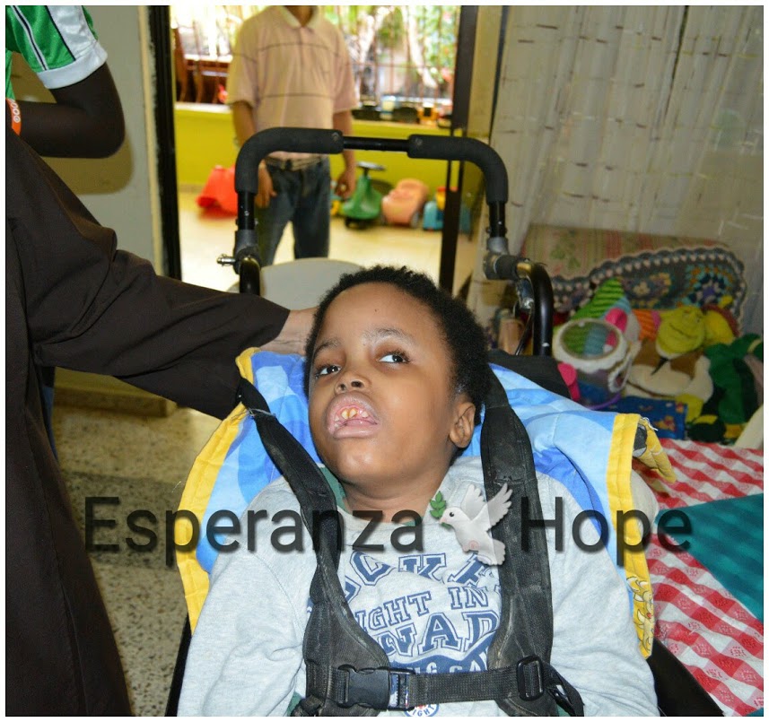 A boy in a wheelchair, text: Esperanza-Hope (text moved)