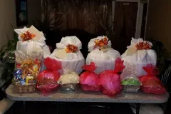 Food baskets and bags of turkey on a table