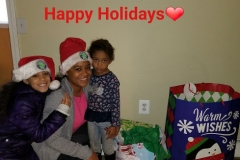 A mom and two girls with text, “Happy Holidays (heart)”