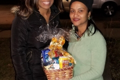 Cropped photo of two women holding a food basket