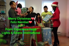 Our staff with a family of five, holding gifts (different movement) and a Merry Christmas greeting