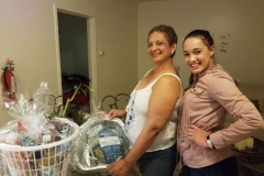 A woman and younger woman and a basket of groceries