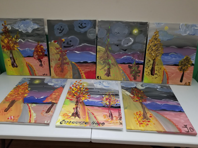 Seven paintings of two trees on a road to a mountain