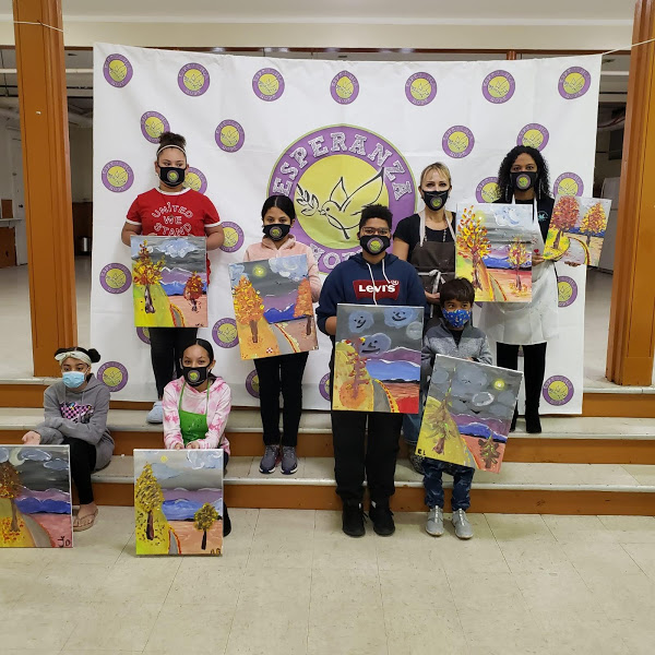 The participants holding their paintings (version 2)