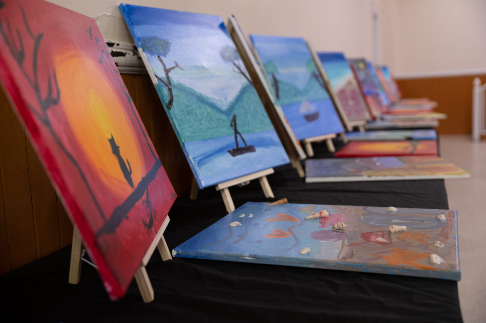 Paintings displayed on the table (view from the side)