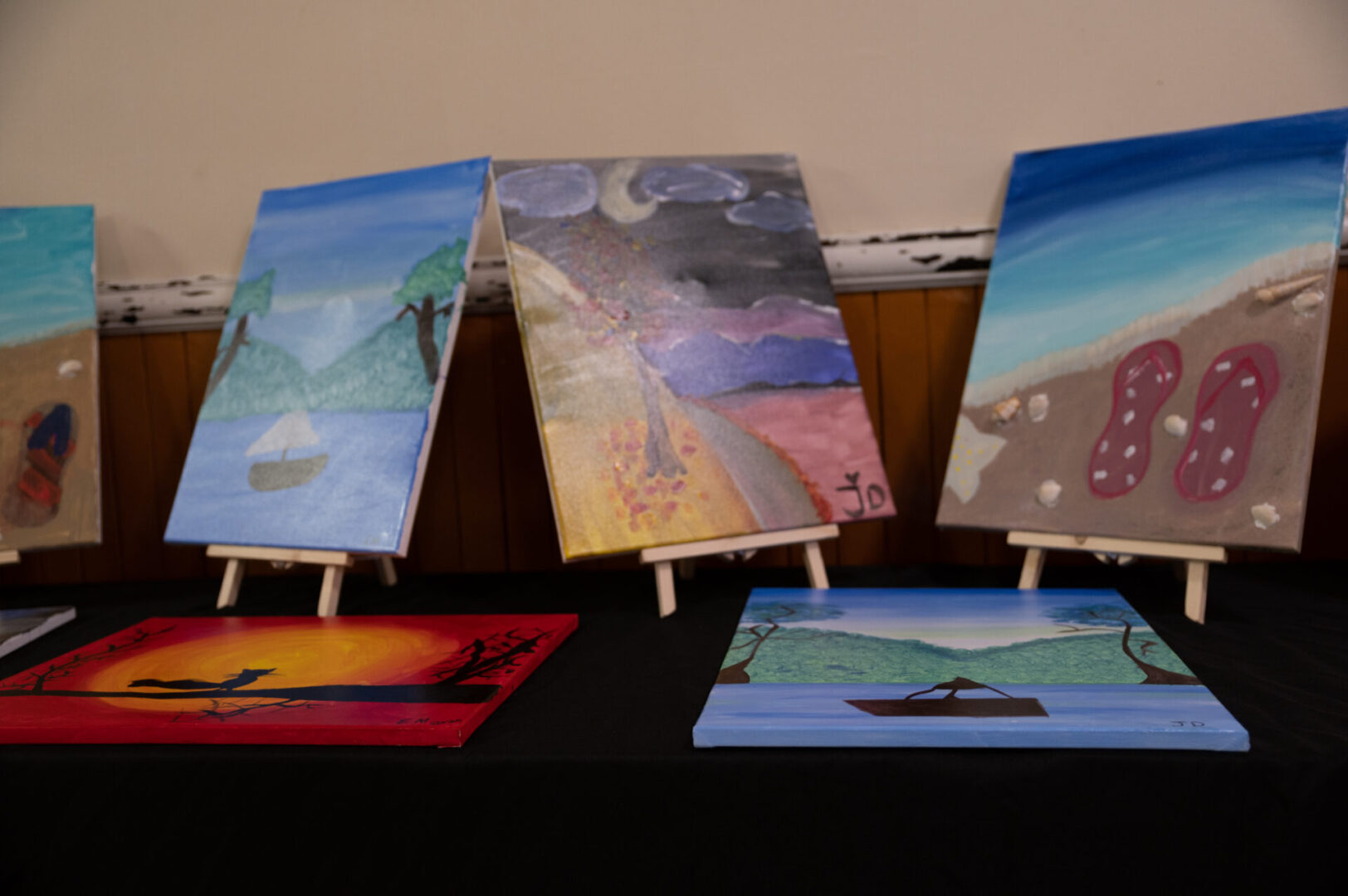 Paintings on a table (blurred)