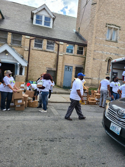 Our staff doing their roles in the food distribution