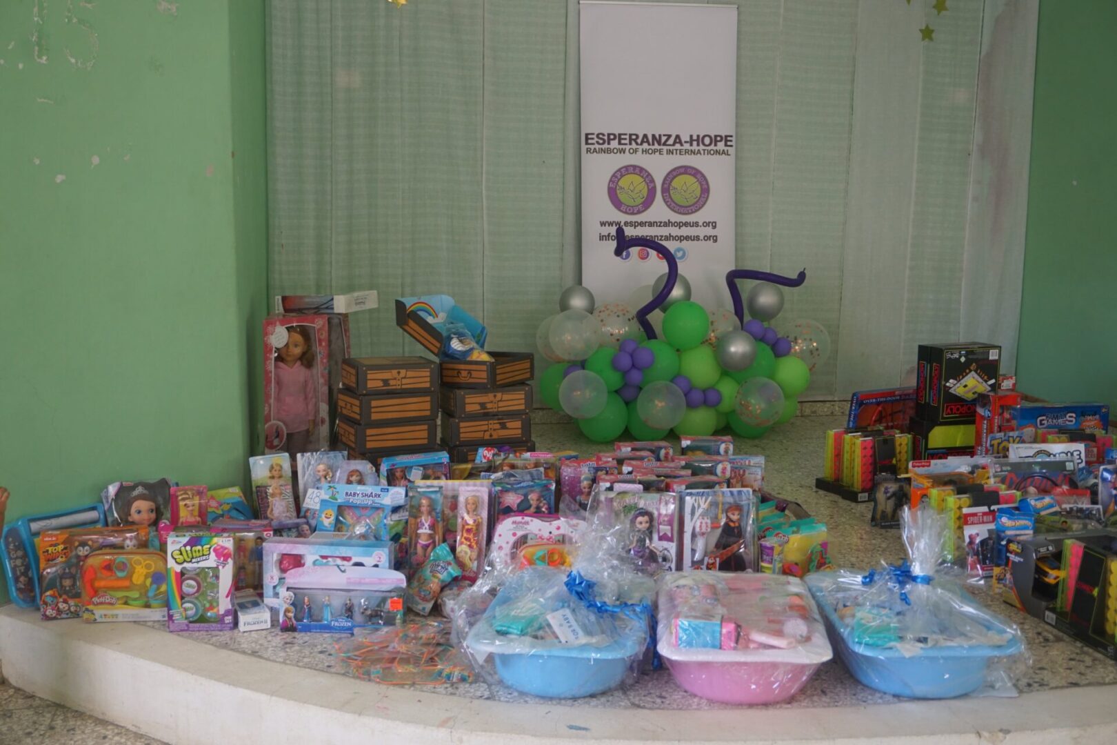 A platform full of various toys and baskets of baby supplies