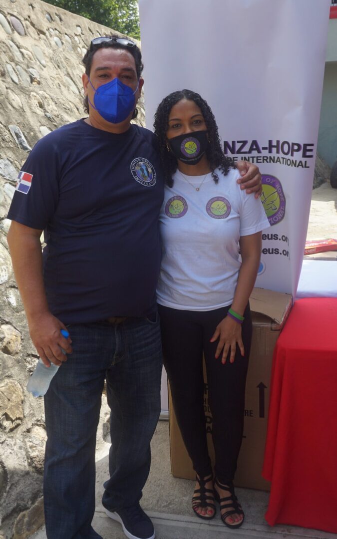 A man and a woman wearing masks