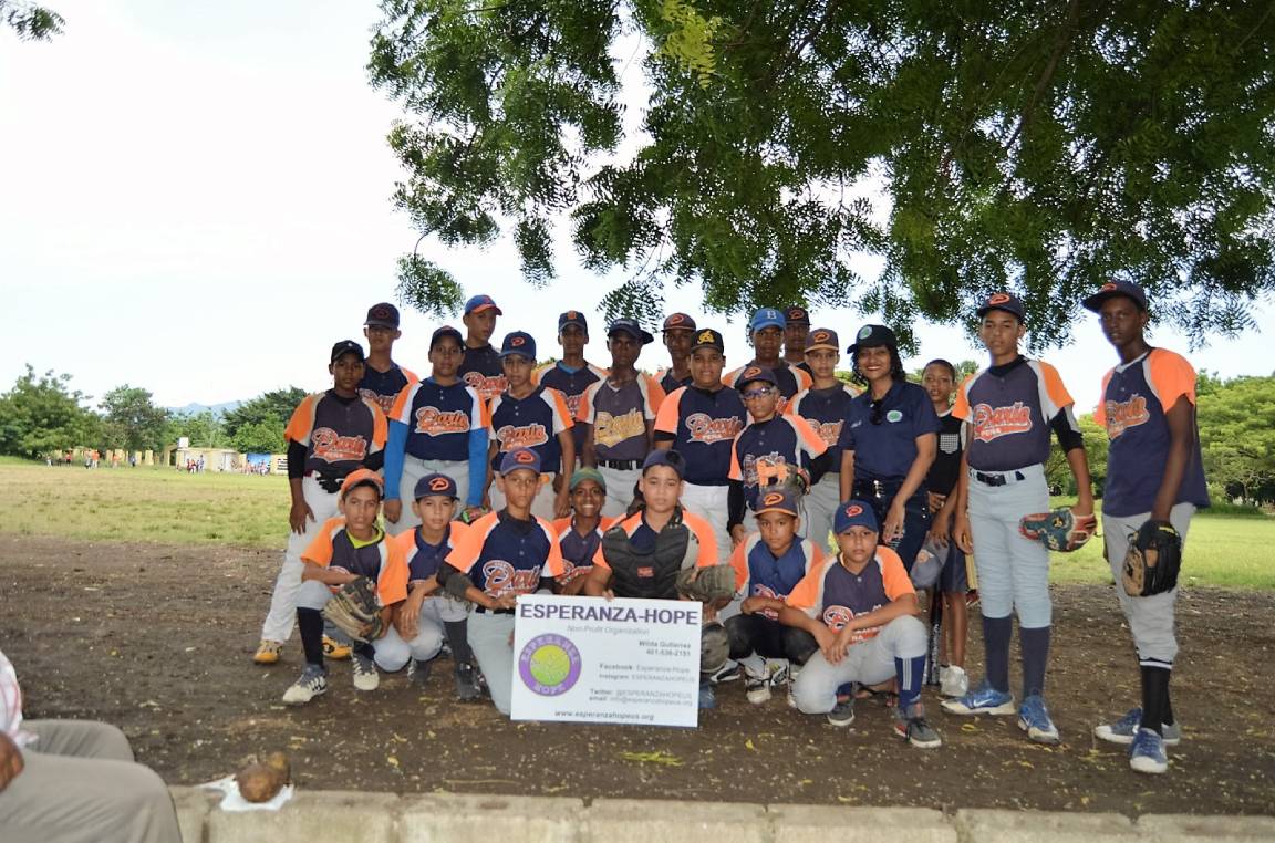 A children’s baseball team wearing a navy blue and orange uniform, version 3