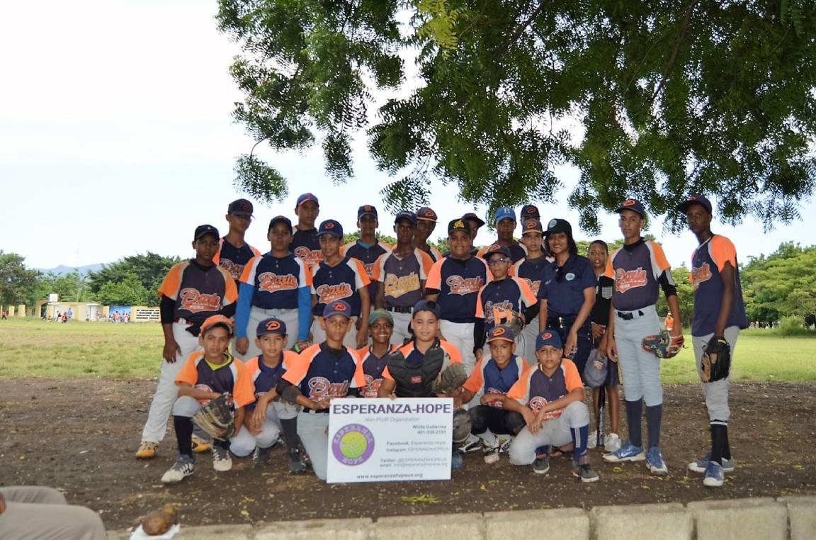 A children’s baseball team wearing a navy blue and orange uniform, version 2