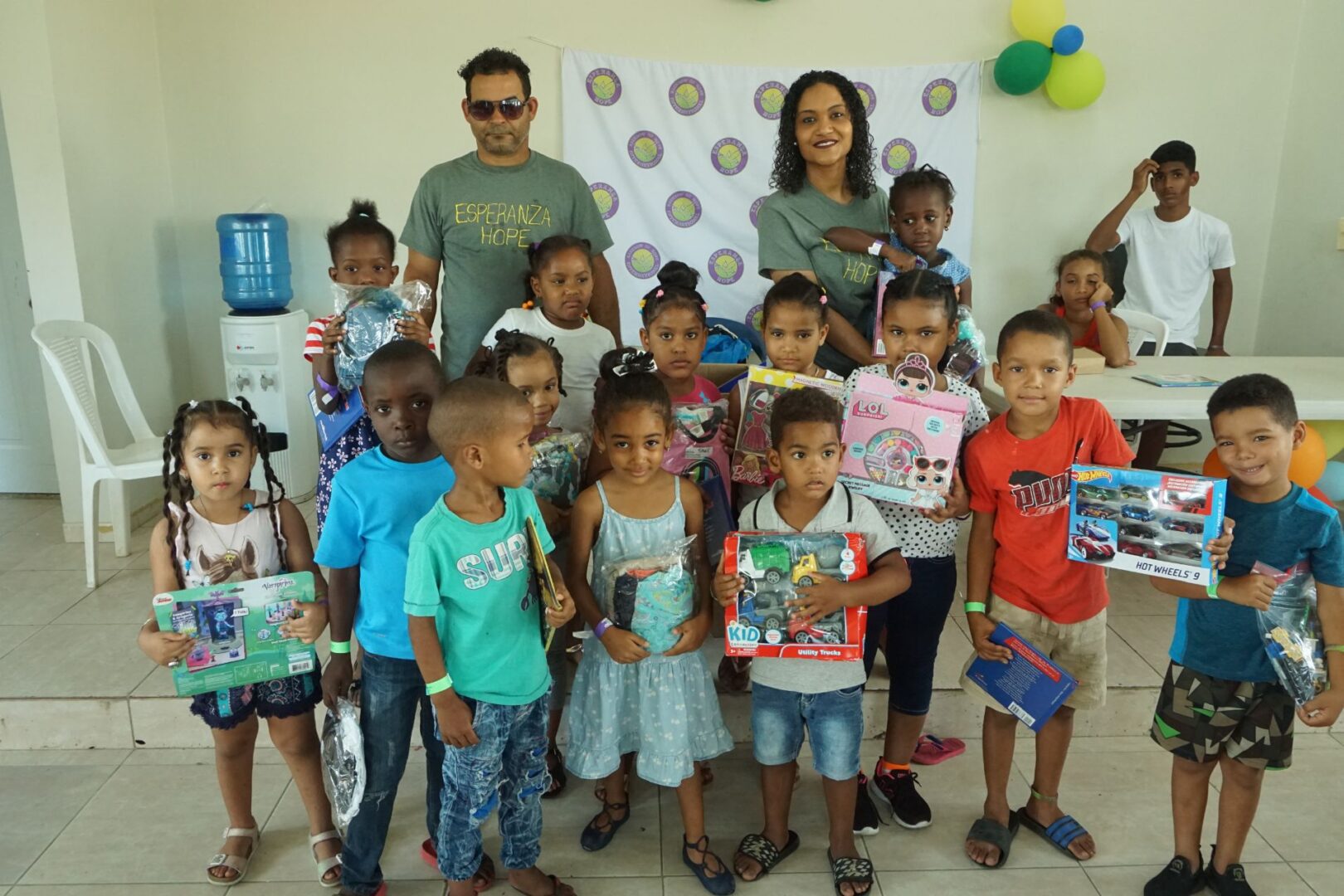Two staff and a group of children holding toys, 3 (scaled)